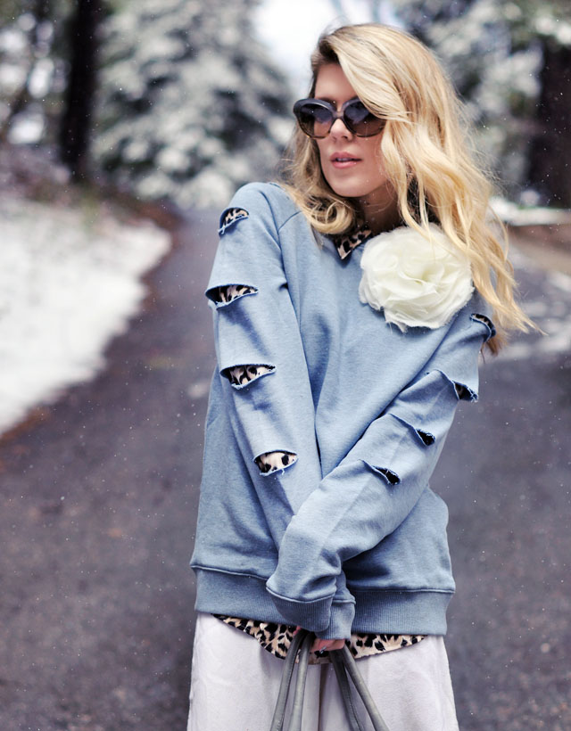 blue slashed sweatshirt with big flower pin and leopard print sleeves