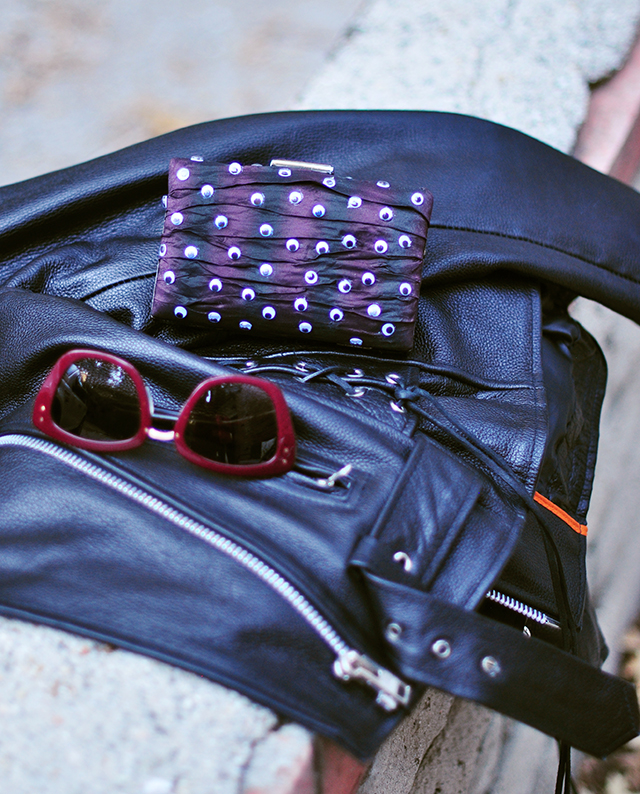 eyeball-clutch_leather-jacket_sunglasses